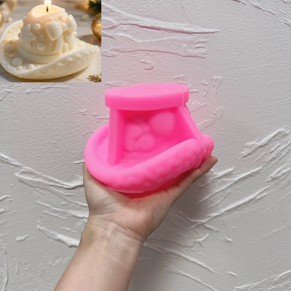 Pink silicone mold for a rounded winter accessory candle shape