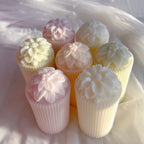 Overhead view of floral tops on ribbed cylinders