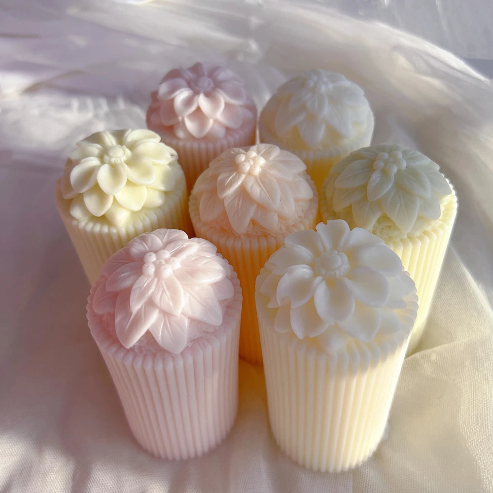 Overhead view of floral tops on ribbed cylinders