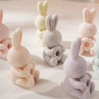 Angled view of upright ears and rounded bunny backs