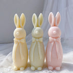 Three standing rabbit candles with long neck bows