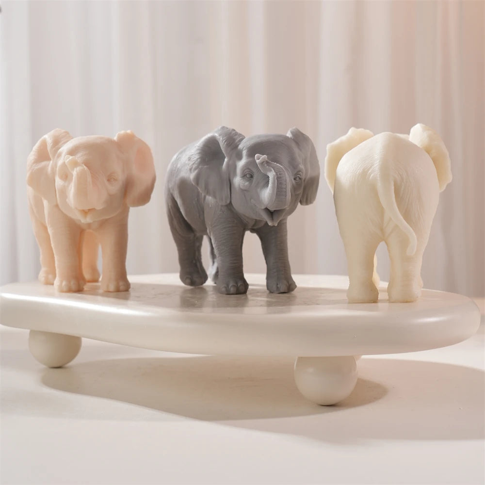 Peach gray and cream elephant castings with raised trunks
