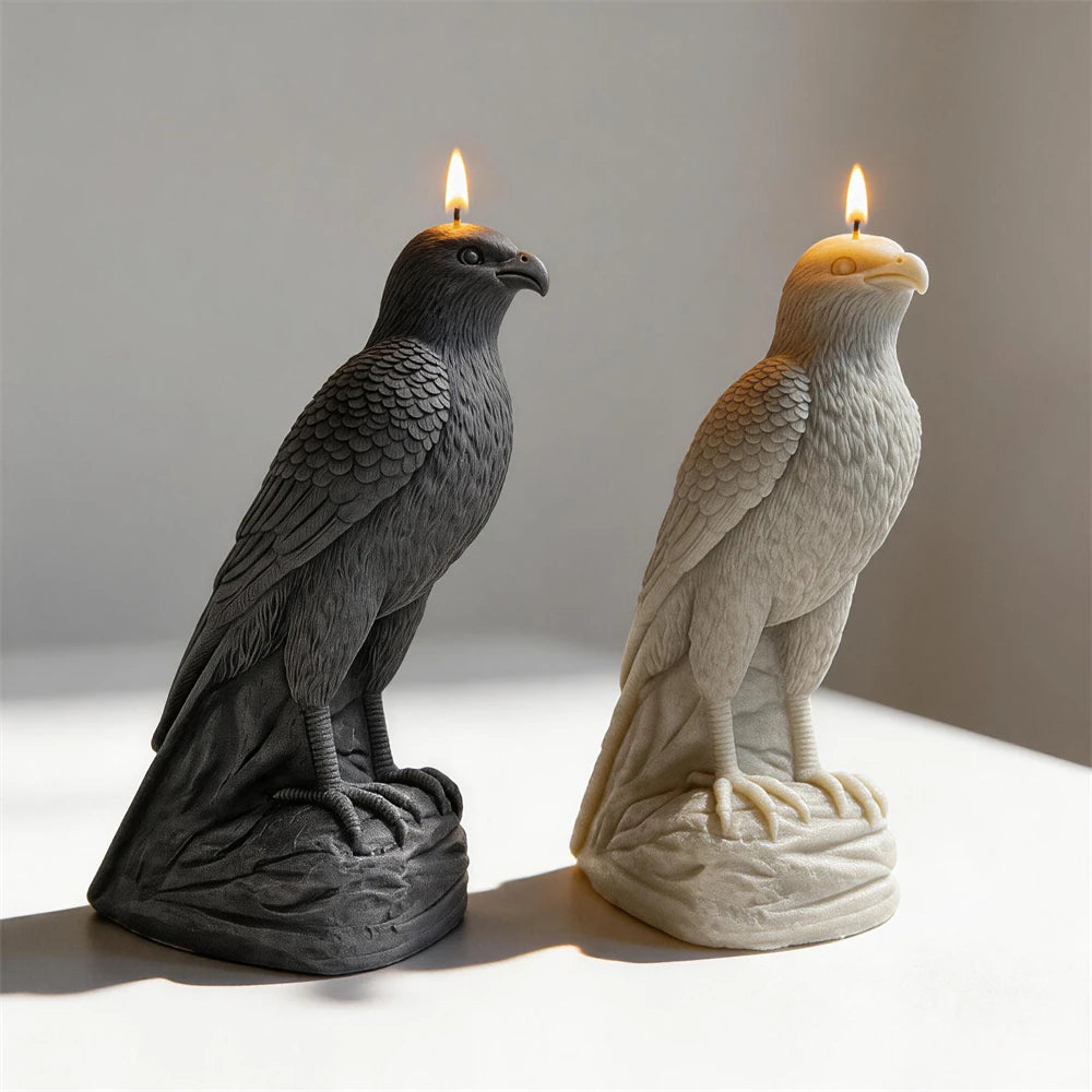 Black and cream perched falcon candles showing feather relief