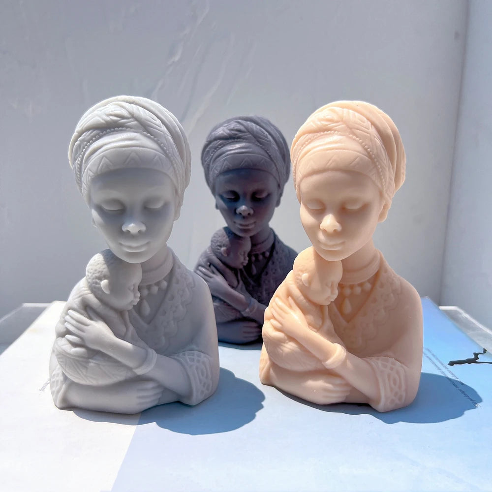 Three portrait busts with babies held across their arms