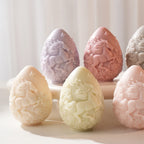 Detailed sculpted horse relief across the side of upright egg candles