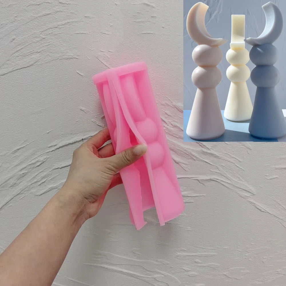 Pink silicone Two Ball Crescent sculpture mold held open