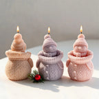Rear and front views of knitted snowman castings