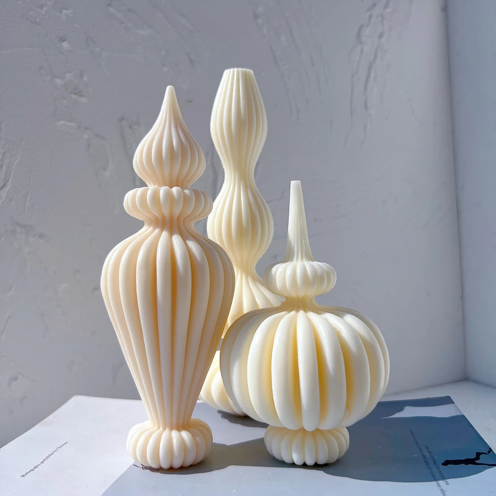 Cream ribbed pillar candles with tapered upper sections