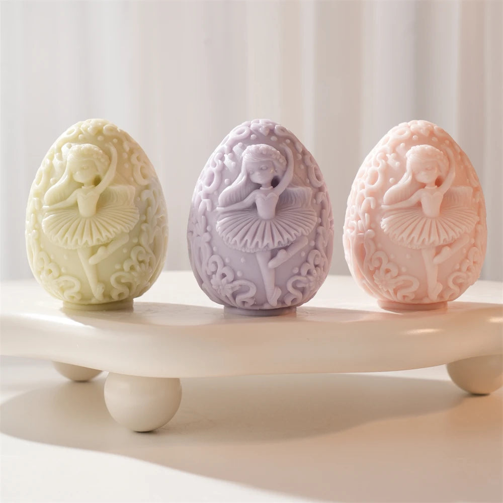 Three ballet figure eggs with raised floral borders