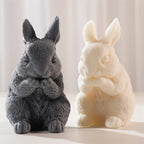 Two seated rabbit castings with upright ears