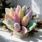 Close-up of textured pastel lilac candle spikes and veined leaves in a wrapped arrangement