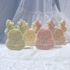 Four forest-scene relief castings in pastel colors