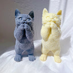 Front view of standing cat castings with raised paws and rounded muzzles