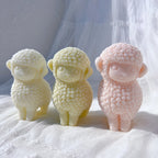 Cream green and pink lamb figures with soft faces and small ears