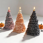 Three lit skull towers showing layered bones and bows