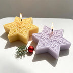 Gold and purple six-point star candles with floral snowflake relief