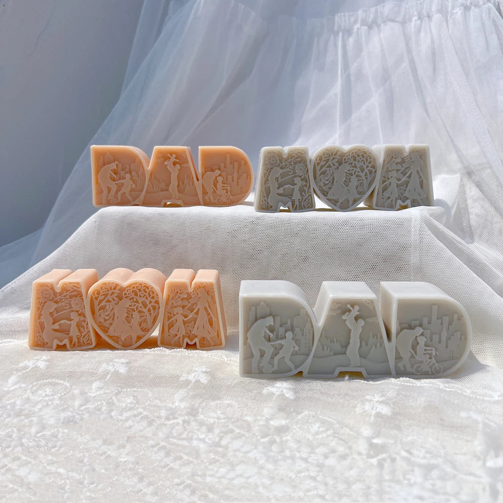 Four DAD and MOM word castings in cream and peach
