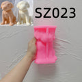 Pink silicone short-coat puppy mold labeled SZ023 held in a hand