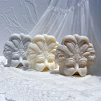 Close-up of sculpted ornamental feather relief on mask castings