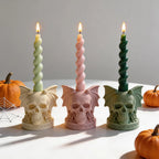 Bat-wing skull holders with twisted taper candles