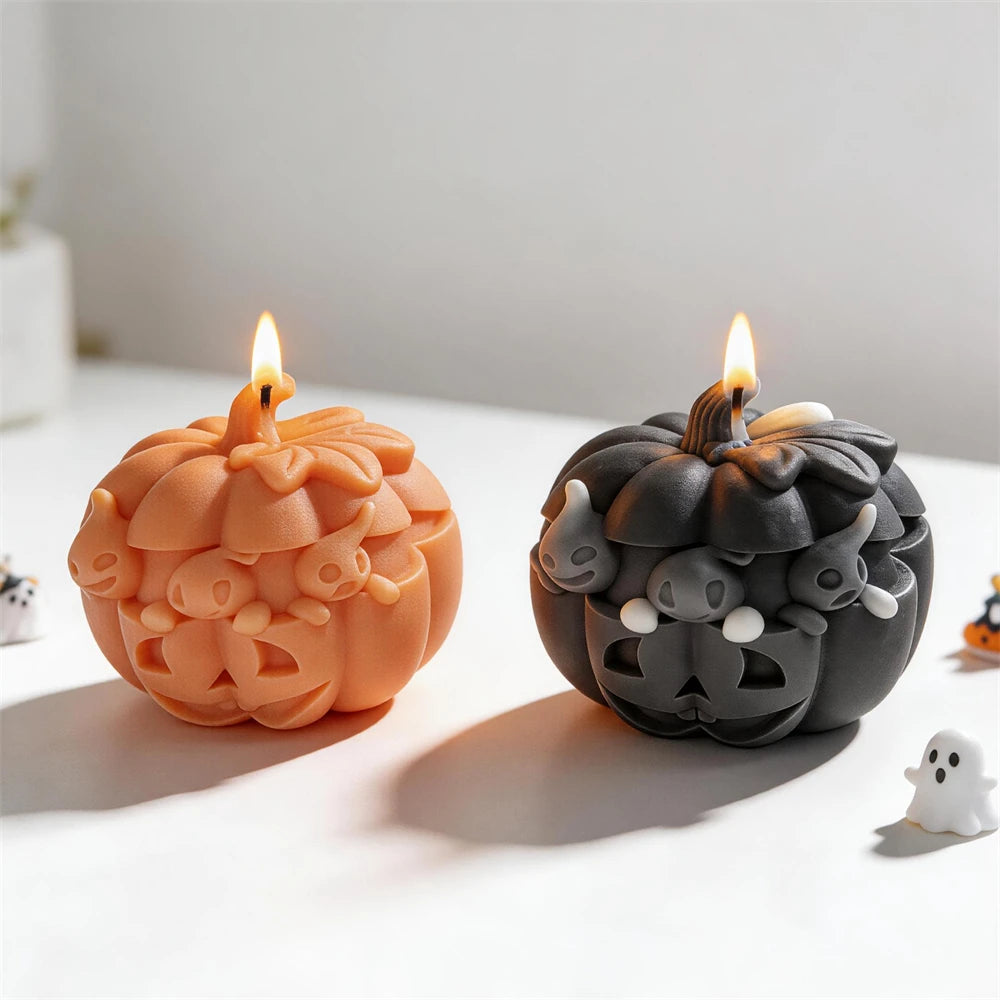 Orange and dark gray pumpkins with small ghost faces around the top