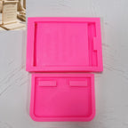 Pink silicone plaque face mold and separate base mold section, with cast example inset