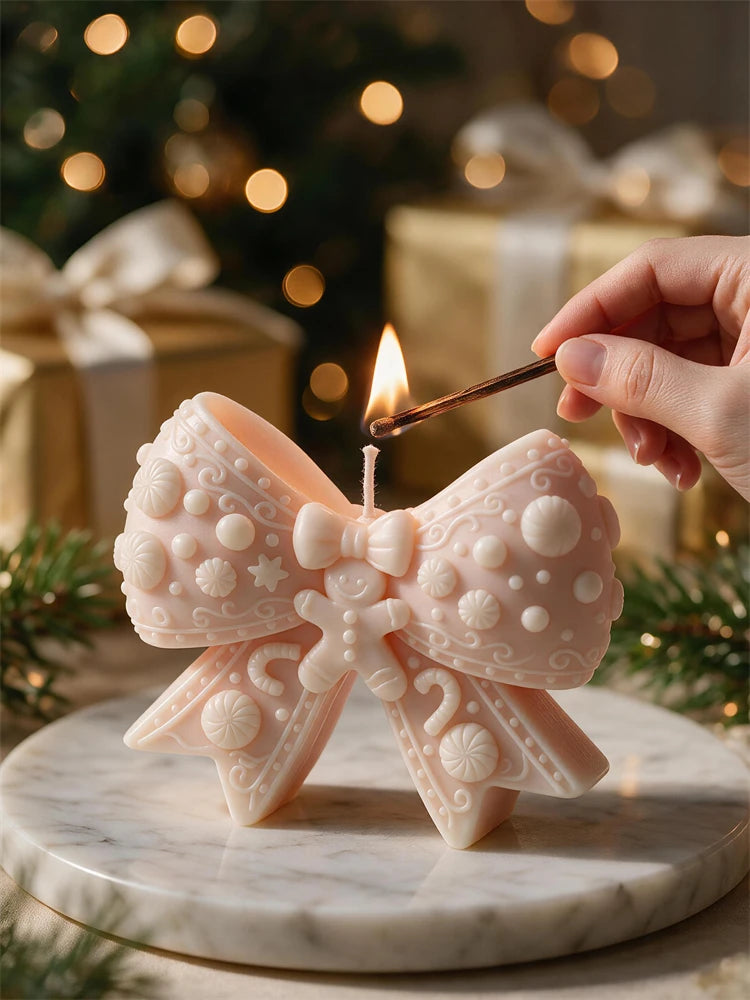 Ornate knitted bow-shaped candle with raised decorative motifs