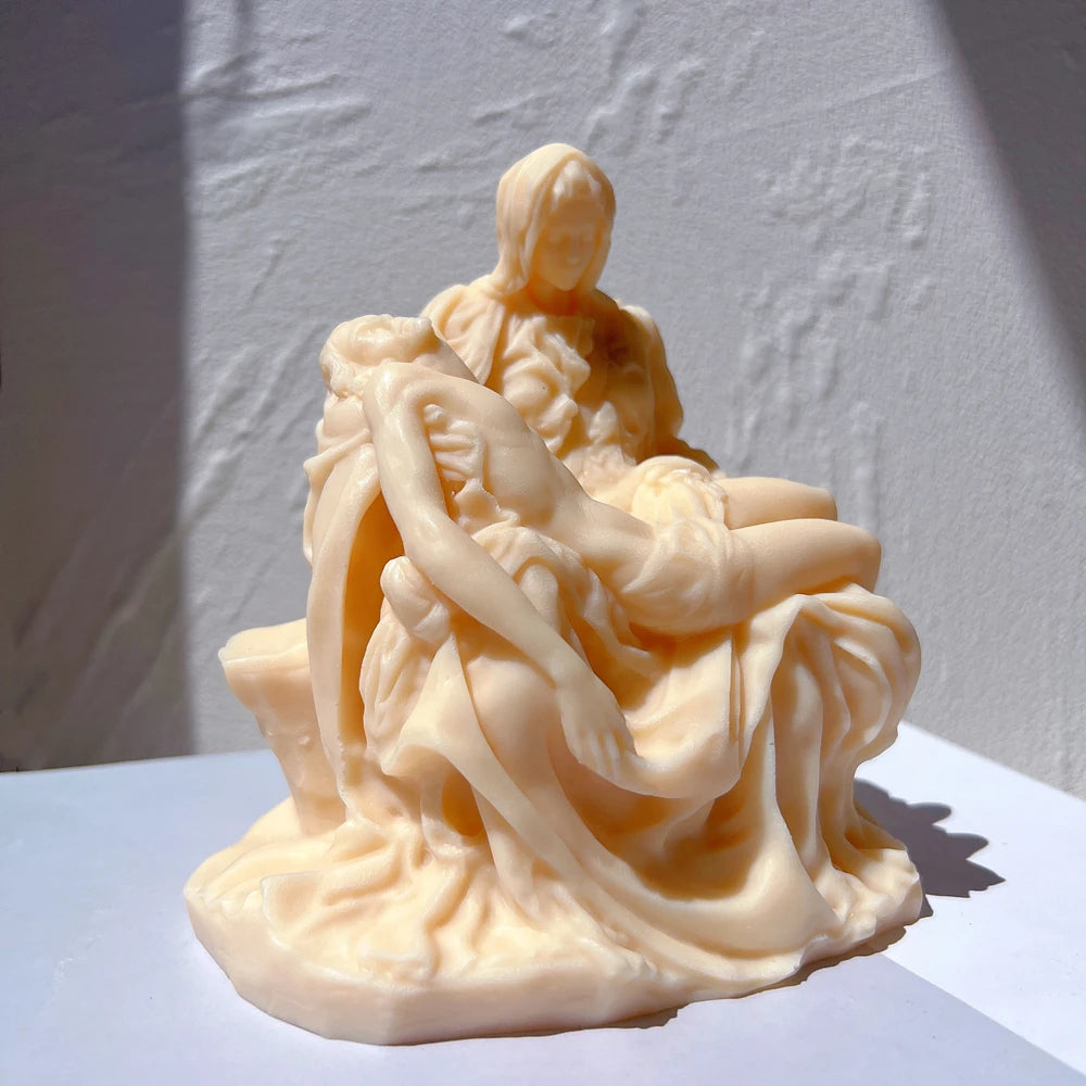 Angled Pietà sculpture casting with detailed drapery
