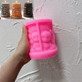 Pink Halloween skull-scene pillar silicone mold held in one hand