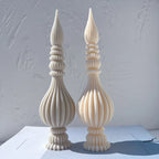 Gray and cream finial castings with long vertical flutes
