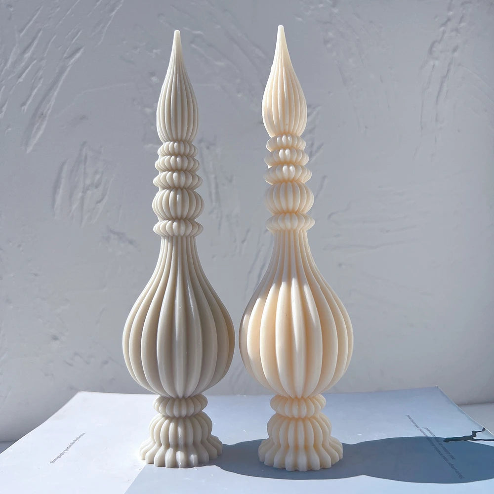 Gray and cream finial castings with long vertical flutes