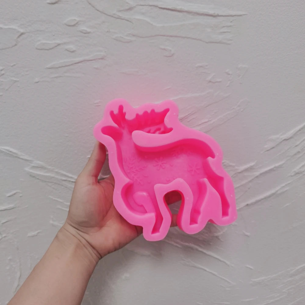 Pink silicone mold for one standing antlered reindeer candle