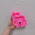 Pink silicone mold for one standing antlered reindeer candle