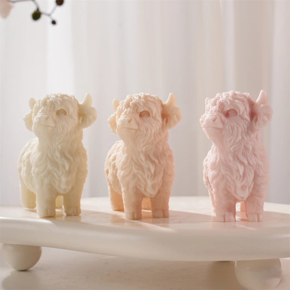 Front view of Highland cow castings with shaggy forelocks and small horns