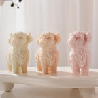 Front view of Highland cow castings with shaggy forelocks and small horns