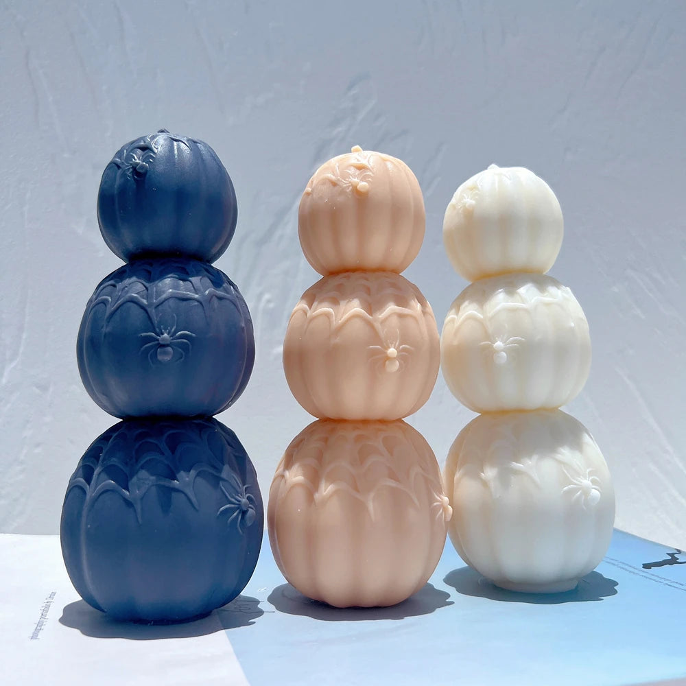 Navy and peach pumpkin towers with smaller pumpkins on top