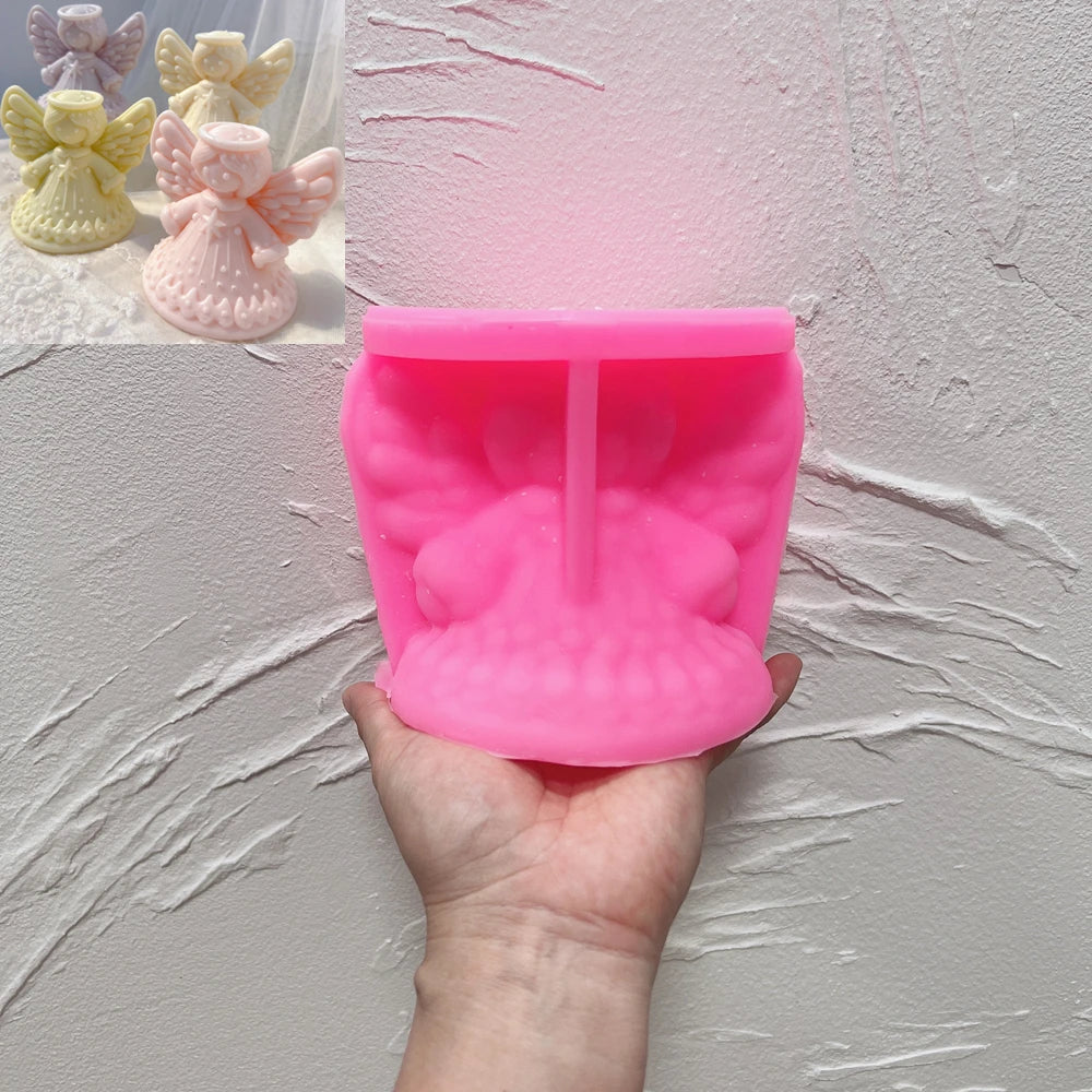 Pink halo angel silicone mold beside matching finished castings