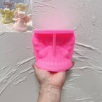 Pink halo angel silicone mold beside matching finished castings
