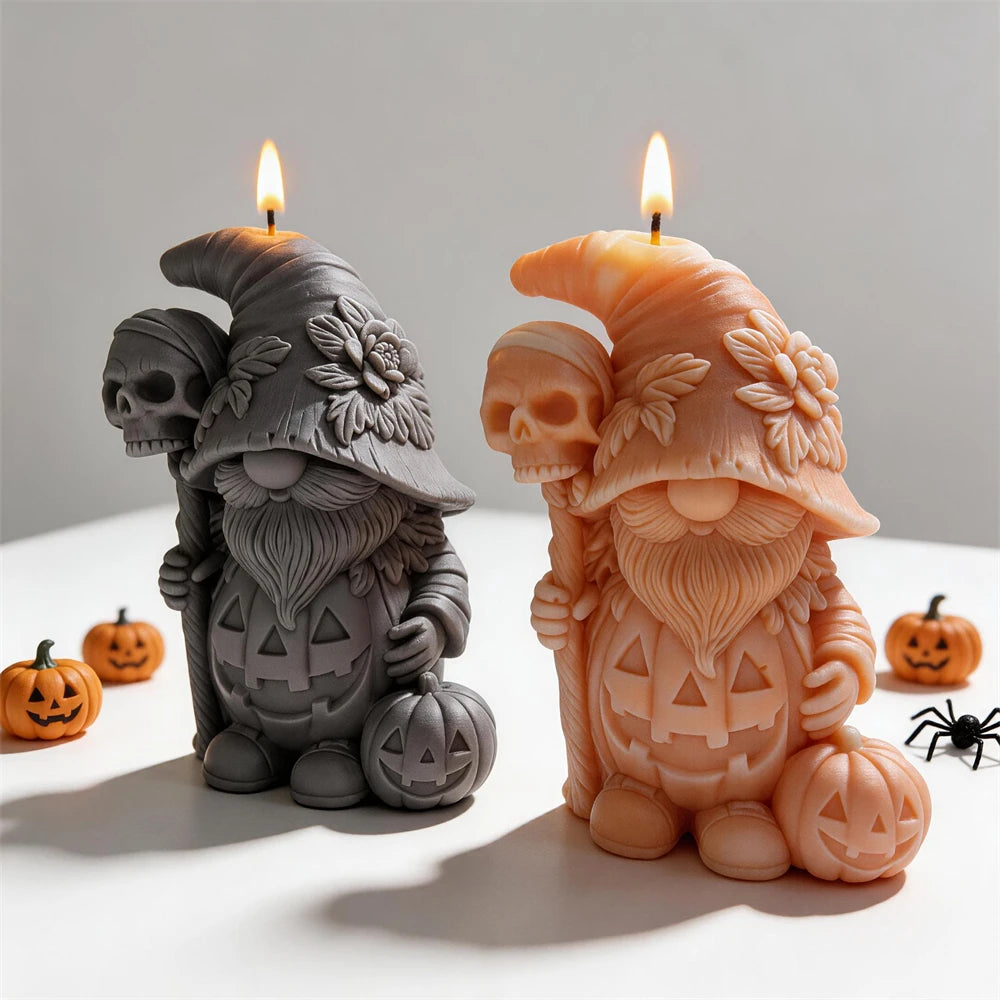 Front view of gray and orange pumpkin gnome candles with round boots