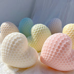 Close view of honeycomb cell relief on cream and pink hearts