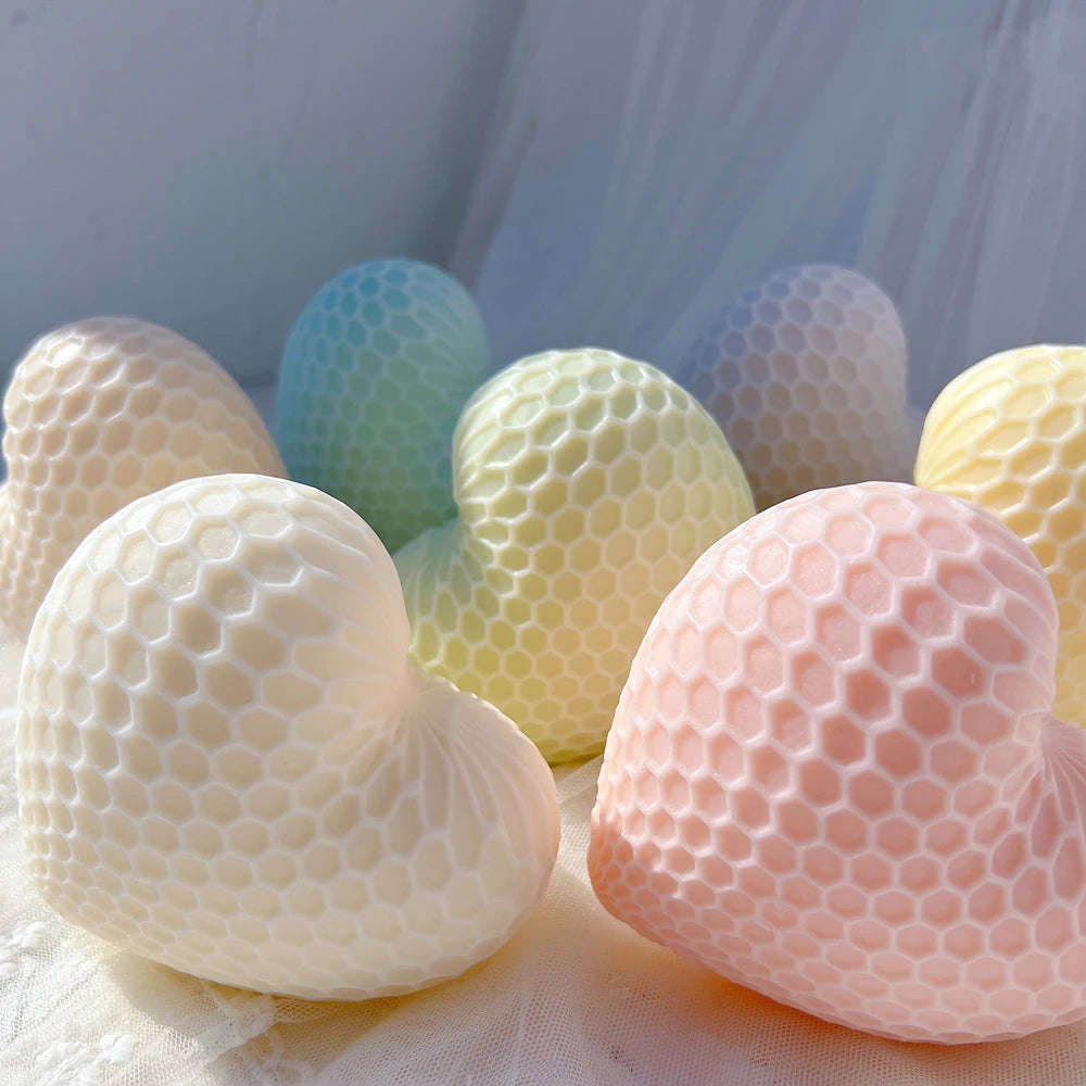Close view of honeycomb cell relief on cream and pink hearts