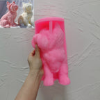 Pink silicone Yorkshire terrier mold held in one hand