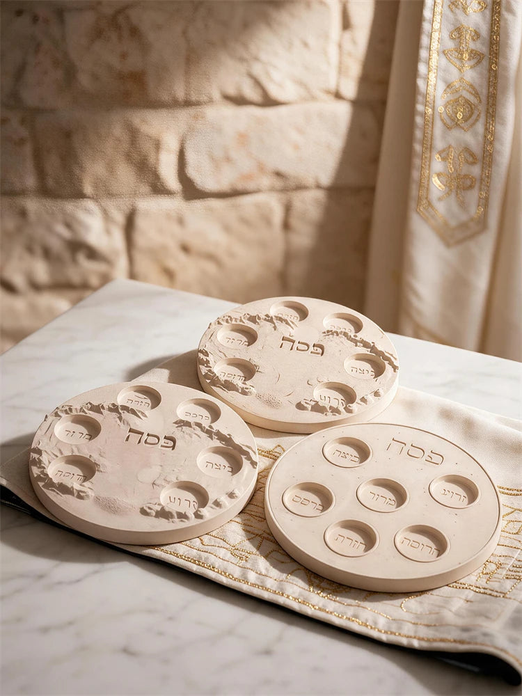Three decorative six-well plate castings on patterned fabric