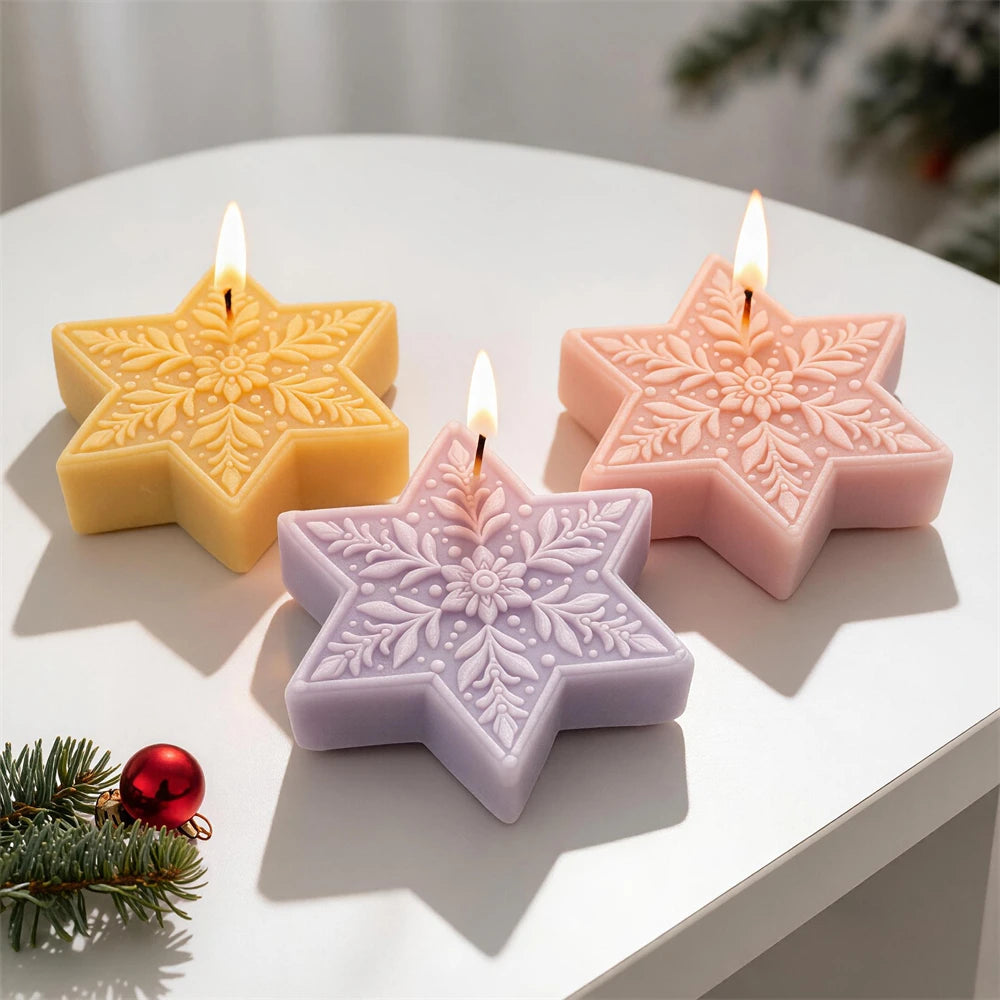 Three winter star castings with decorative floral faces