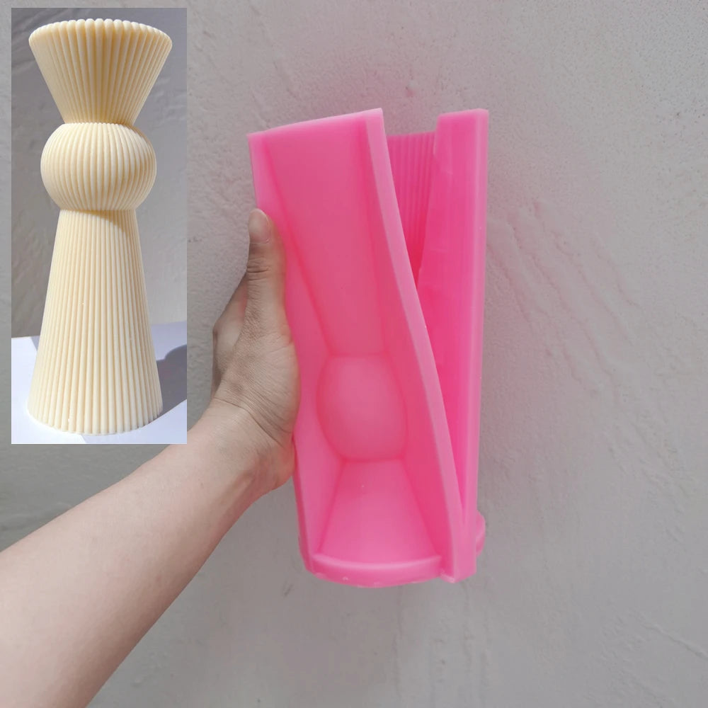 Pink Single Sphere silicone mold beside its matching casting