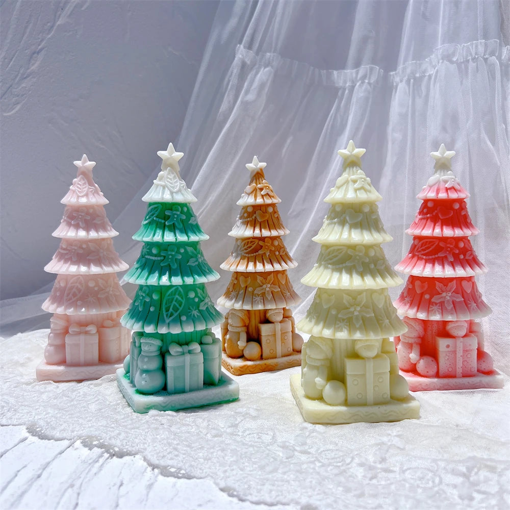 Five decorated tree castings with integrated gifts at the bottom