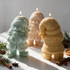 Front and rear views of gnome candles with winter clothing