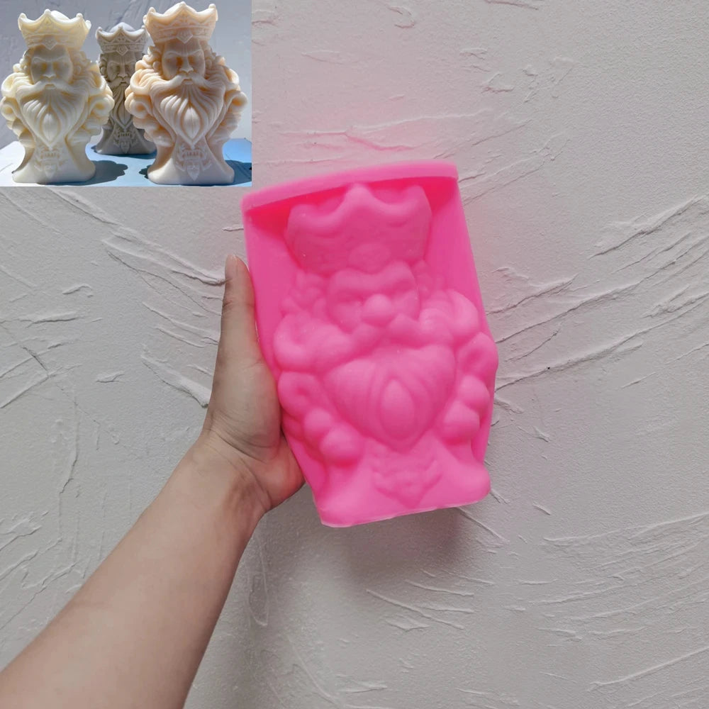 Pink king silicone mold beside crown-topped bearded head castings
