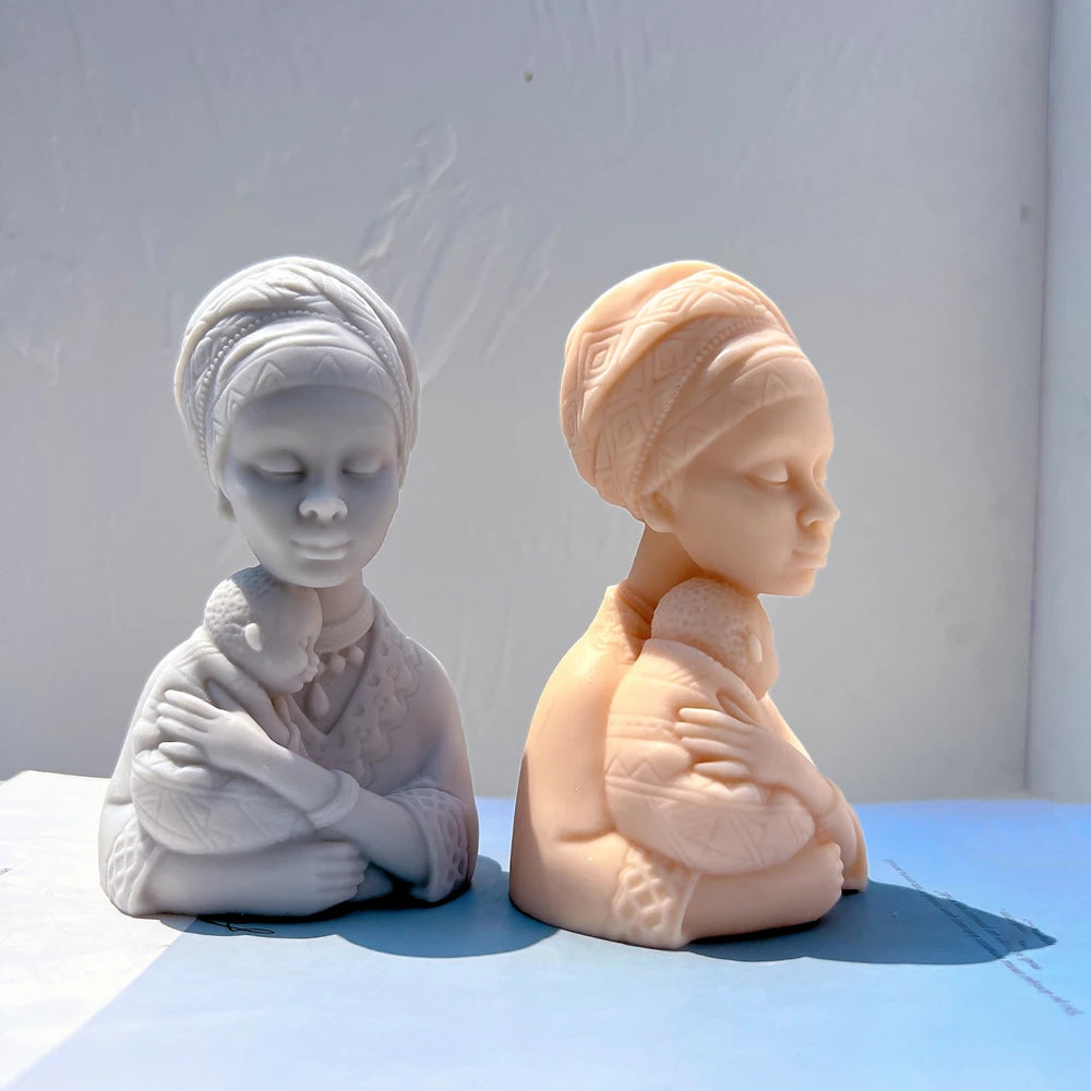 Front and profile views of a headwrapped mother bust