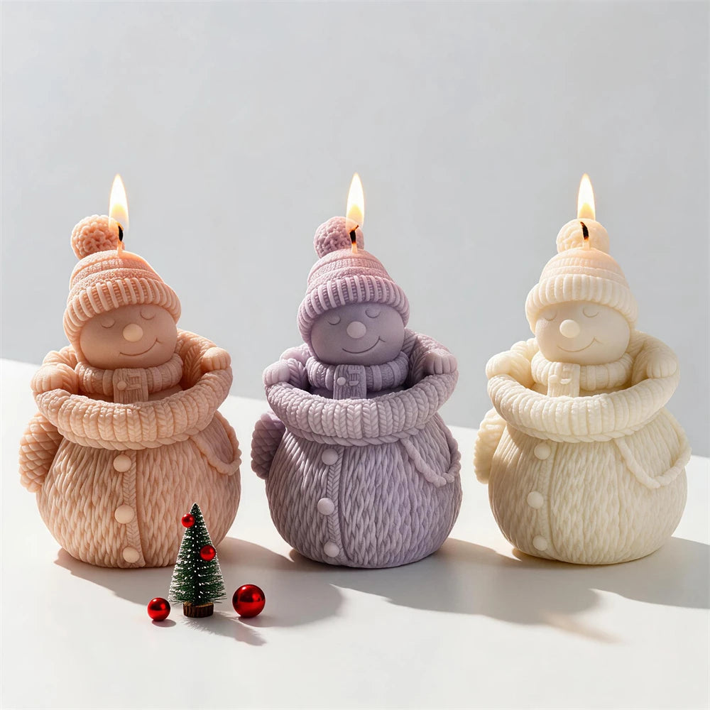 Knit snowman candle examples in three pastel colors